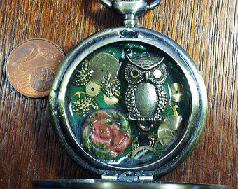Steampunk pendant made of a pocket watchcase gears, a nice unakite flower, incristal resinb4h0-029