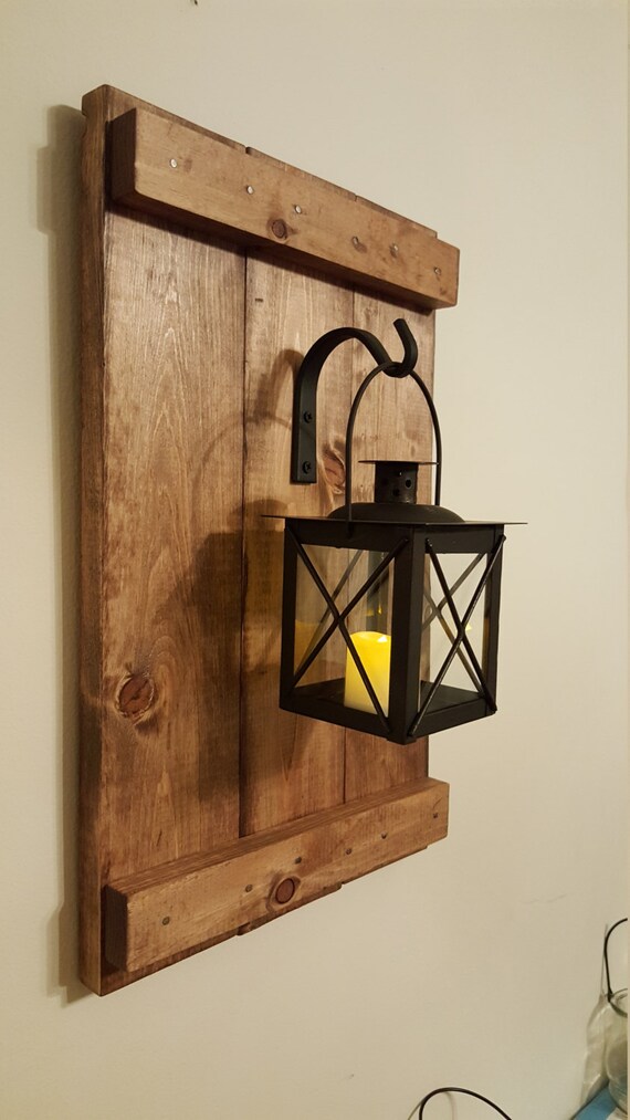 Lantern with wrought iron hooks rustic wood boards rustic