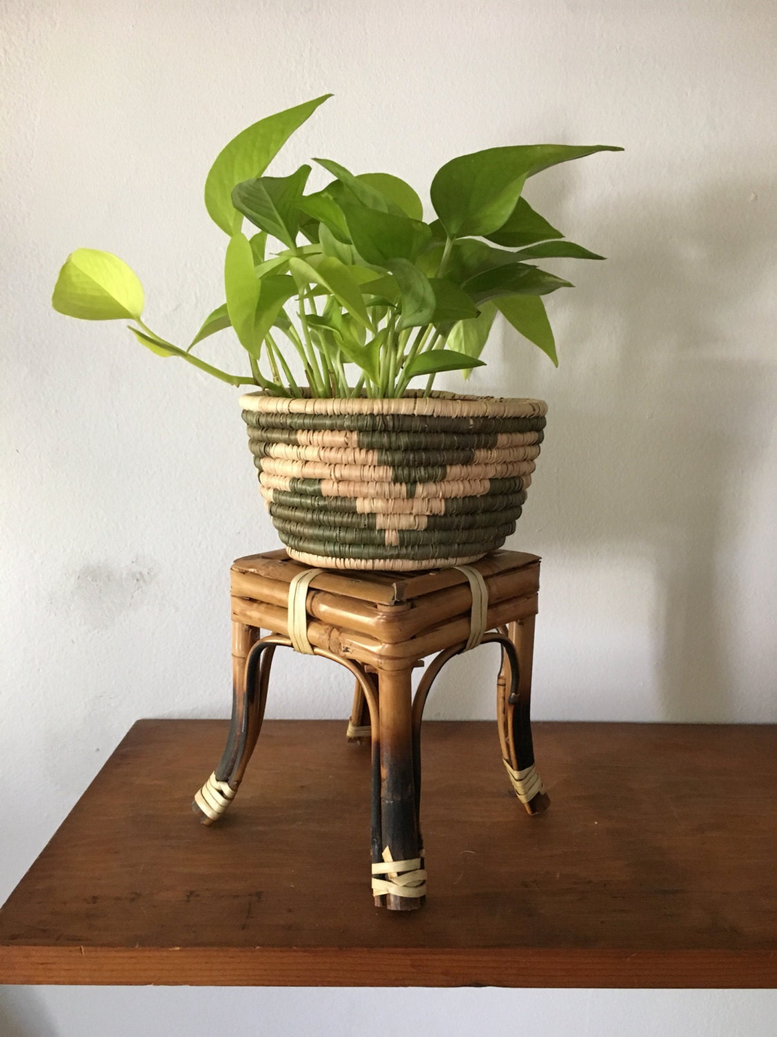 small rattan antique plant stand. vintage boho style plant