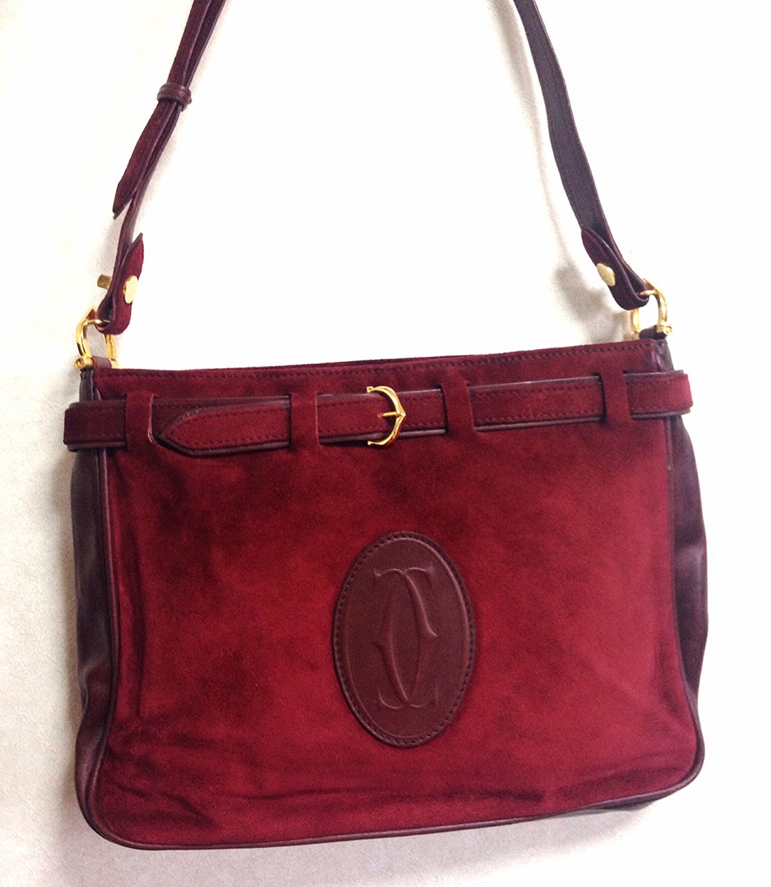 Vintage Cartier wine suede leather shoulder bag with a