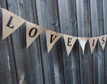 Burlap / Hessian 'LOVE IS SWEET' with hearts. Wedding or engagement decorations. Photo prop