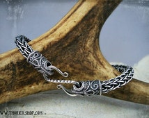 Silver Viking bracelet with raven head terminals and a clasp. Viking knitting bracelet, jewelry for reenactors