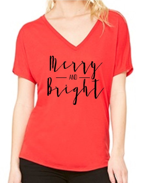 Items similar to Merry and bright christmas graphic tee women\u002639;s slouchy tee vneck 10 Colors on 