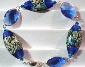Bracelet: Atlantis Lampwork Beads, Faceted Sapphire Glass/SP Oval Links, Caribbean Blue Opal AB 2X Swarovski Crystals, & Sterling Mag Clasp