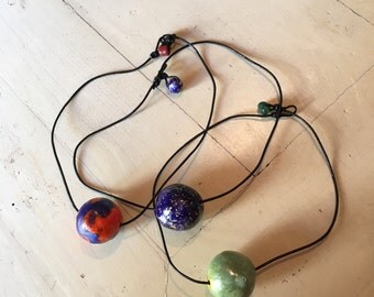 Ceramic necklaces sculpted and decorated by hand. Handmade ceramic necklaces. One of a kind!