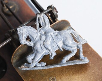 Antique lead toy, figurine man riding a horse. "headless horseman"