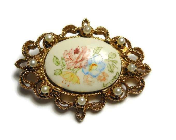 Floral hand painted brooch pink roses and yellow and blue flowers with gold filigree open work frame with seed pearls, signed Lyndell