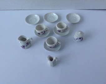 Antique Childs Tiny Tea set .