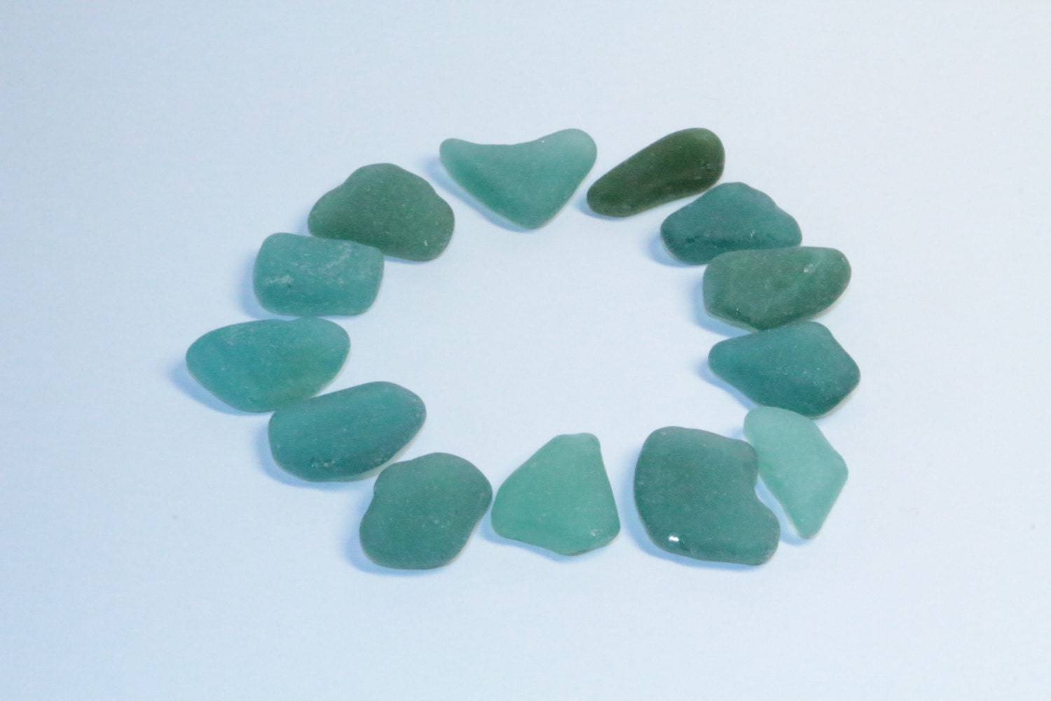 Genuine teal sea glass. 13 pieces of natural sea glass. Flat
