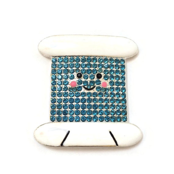 Items similar to Blue Bobbin Needle Minder Sewing