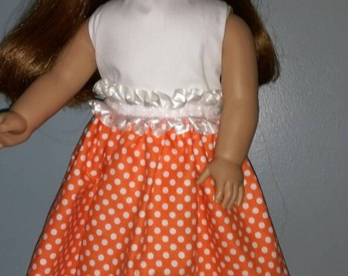 Orange polka dot dress fits dolls like American Girl and 18 inch dolls for summer