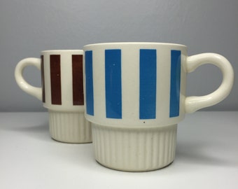 two vintage USA Pottery blue and brown striped stacking mugs