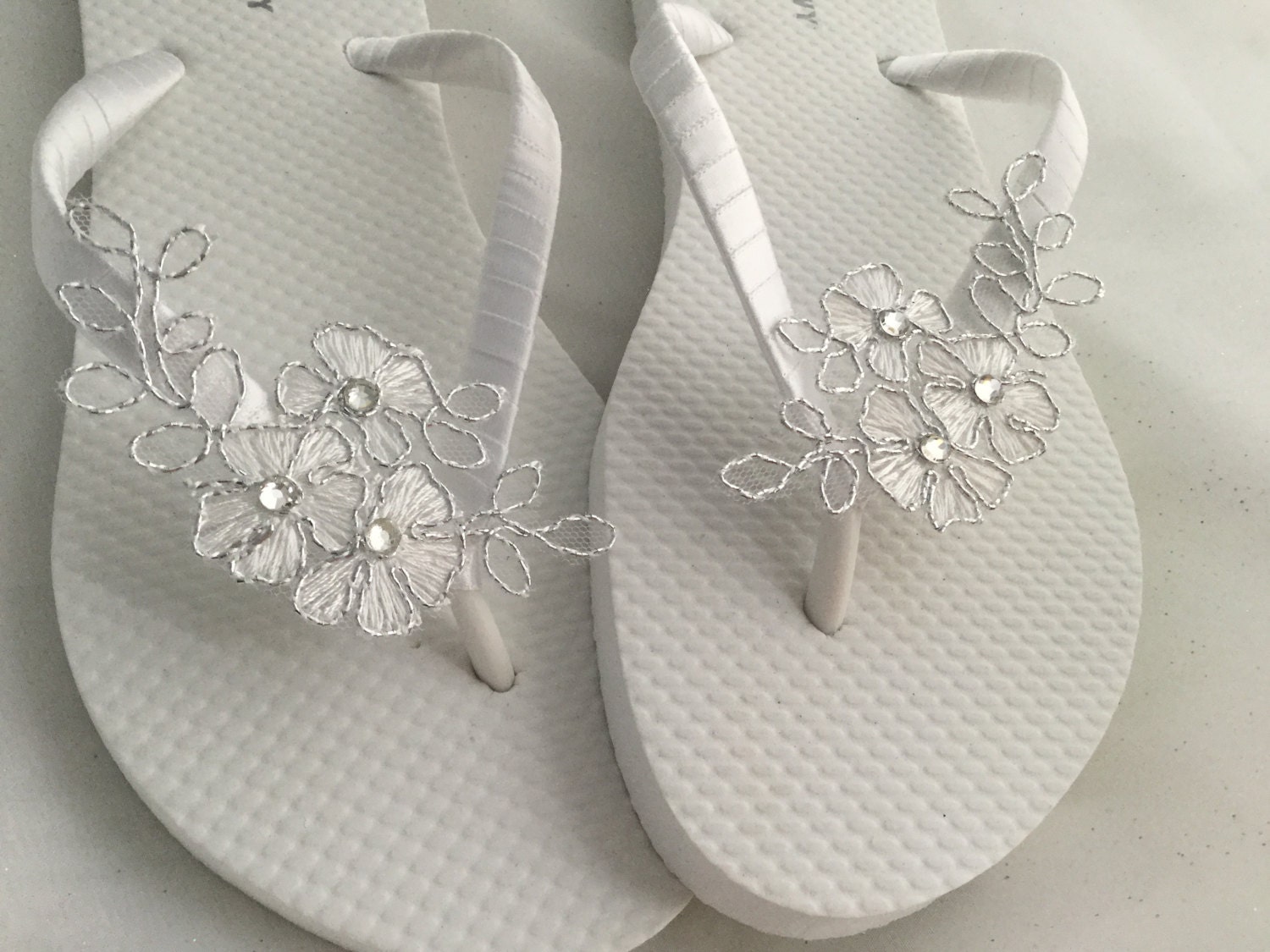 white lace flip flops