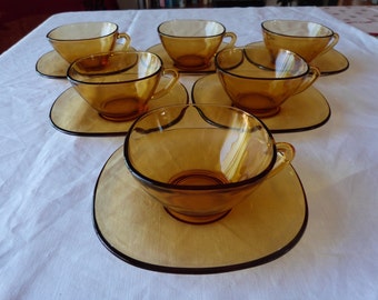 Six stylish, retro amber tempered glass, coffee cups and saucers by Vereco France. French retro glass.
