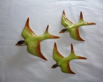Ceramic flying swallows . Wall hanging
