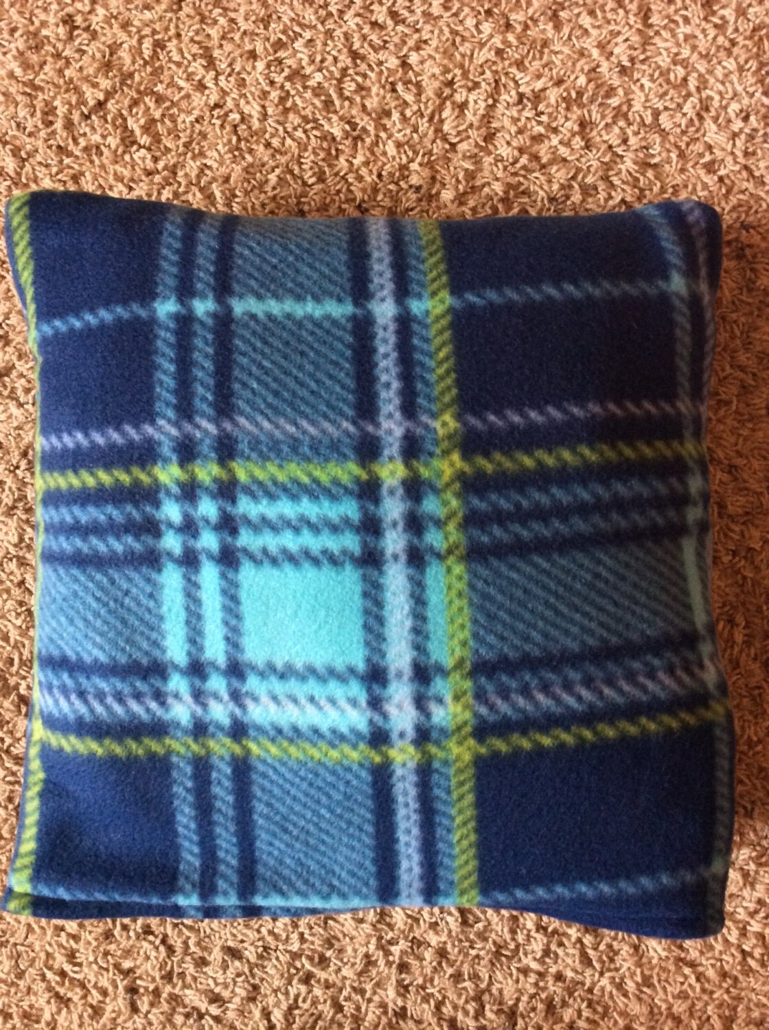 Blue plaid quillow blanket in a pillow throw fleece