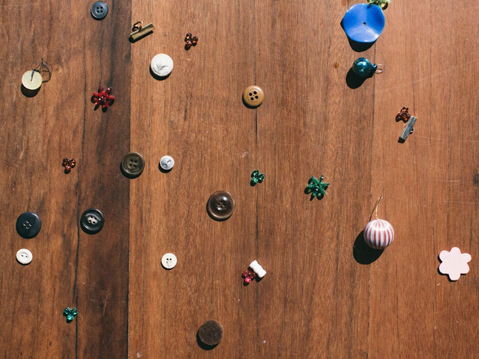 Buttons scattered on a wooden table Buttons scattered on a wooden table