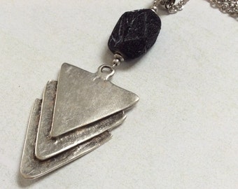 Triple triangle antique plated silver pendant necklace. Black lucite nugget.