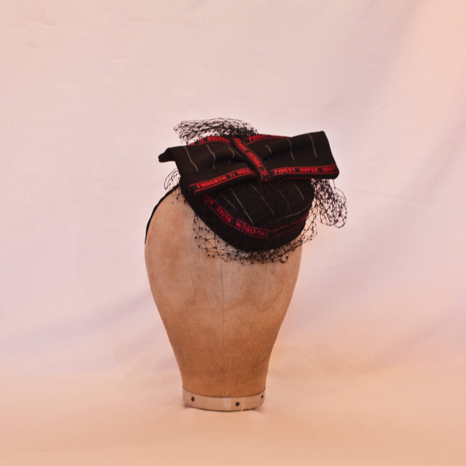 Unique handmade ladies hat using Savile Row British wools displaying ‘Made in Huddersfield’ selvedge