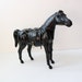 antique leather horse figurine