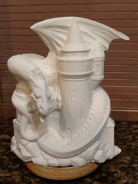Dragon on a castle 10 tall ceramic  bisque  ready to paint
