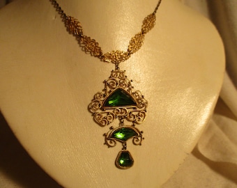 Antique filigree necklace with emerald green stones
