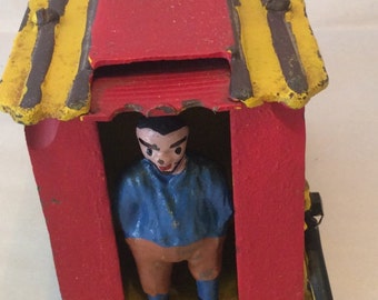 Cast Iron Bank of Man Kicking Coin onto Roof