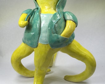 Skleeb the one-eyed chartreuse tentacle monster wearing a teal hoodie