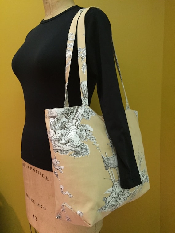 Tote bag with pockets. Roomy tote with button and loop closure. Pretty print fabric