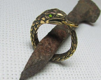 Ouroboros or Uroboros Bronze Amulets Infinity Pendant in the eyes of the phosphor luminophore