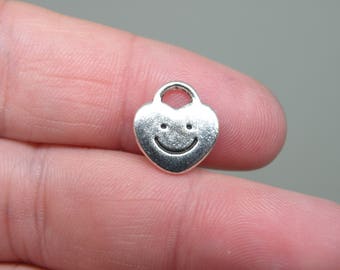 10 Silver Tone Smiling Heart Charms. B-004