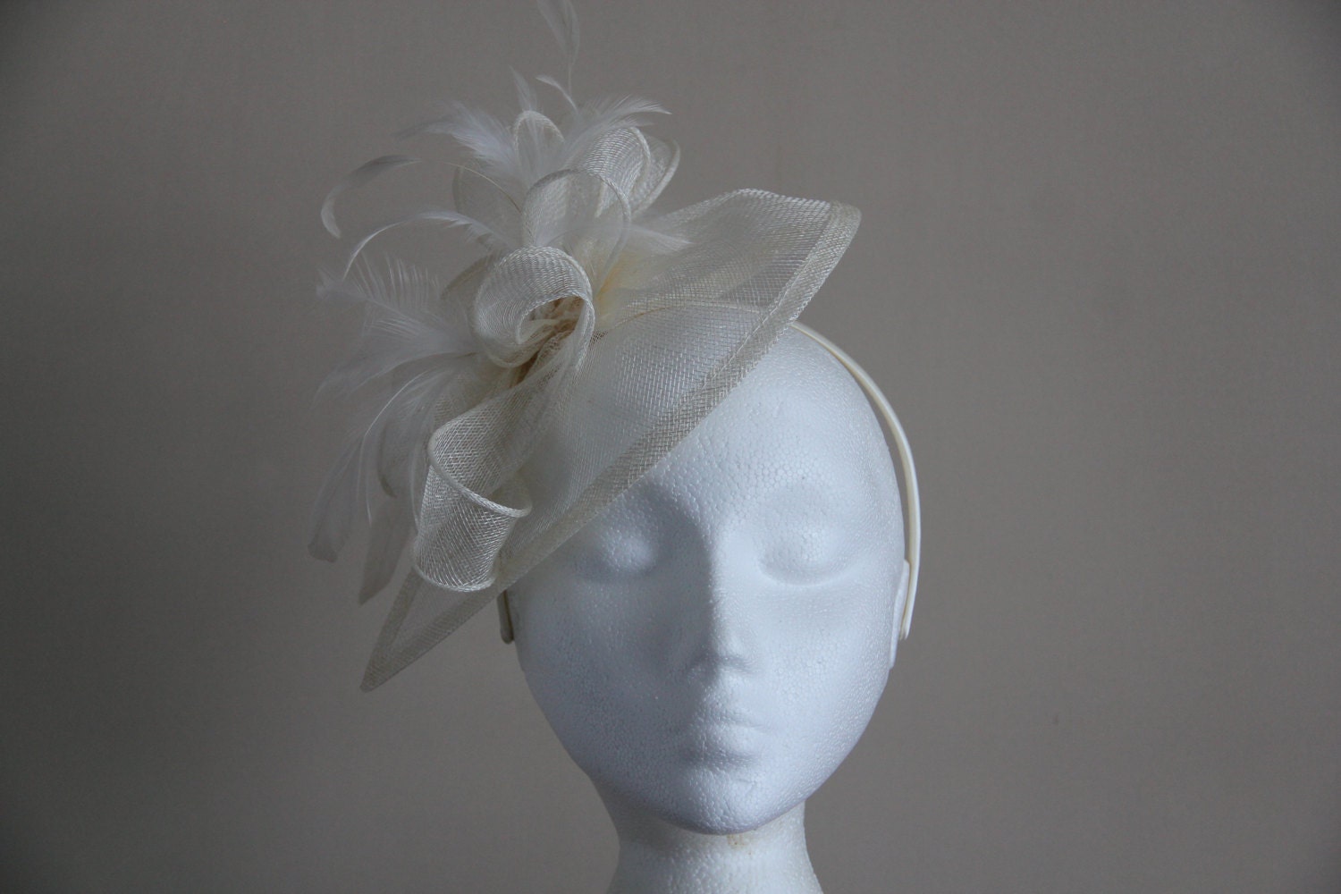 Ivory Cream Fascinator and Feather Fascinator on a hairband