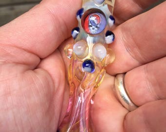 Steal Your Face Glass fumed pipe one hitter. Hand blown Grateful Dead Millie with highlights. Color changing. Flat mouth piece