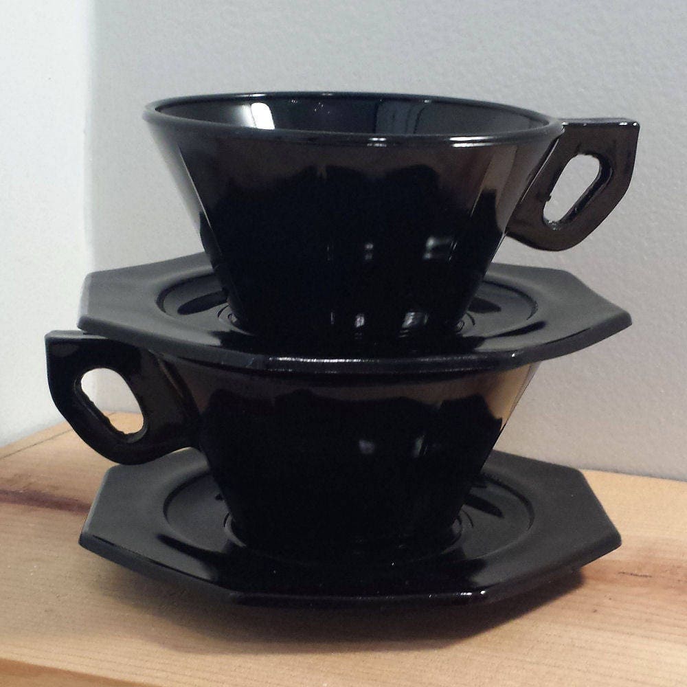 U.S. Scroll Black Glass Teacup and Saucer Set 4 piece vintage