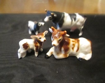 Two Sets of Miniature Bone China Cows with Calves