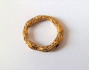 Round and hammered rings of antique gold color