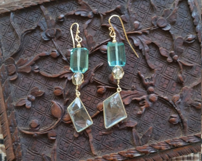 Earrings with a Beautiful Mystic Aqua Blue Crystal Stone and a Small Glass Bead. The Pale Aquamarine Drops Both Have Rainbows in Them.