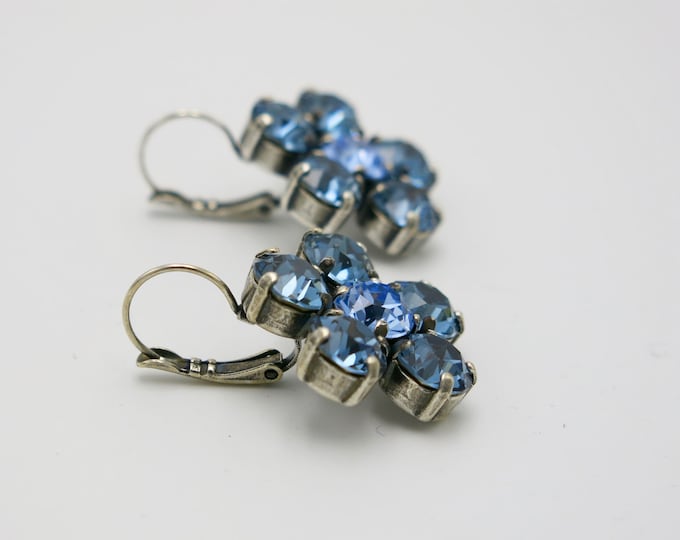 Blue sapphire Swarovski crystal flower earrings. Floral-inspired design resemble elegant drop dangle earrings perfect for a night out.
