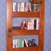 Handmade bookshelf from repurposed old door