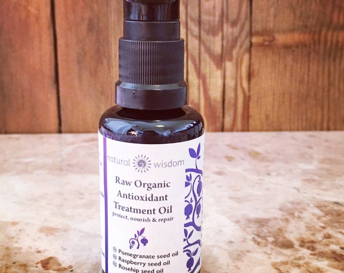 Raw Organic Anti Aging Face Oil made from Raspberry, Rosehip, & Pomegranate CO2 extracted seed oils to protect, nourish and repair.
