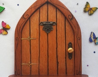 Wooden Fairy Door, Handmade with oak, patterned frame, with moving door knocker, also includes Butterflies and Fairy Dust