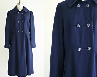 1970s vintage wool coat . 70s navy blue princess cut winter double breasted coat . military style . medium to large