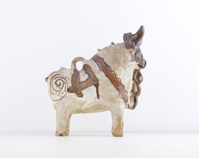 Handcrafted ceramic Bull, statue figurine of a stylized bull, Pucara Peruvian Andean traditional folklore myth storytelling