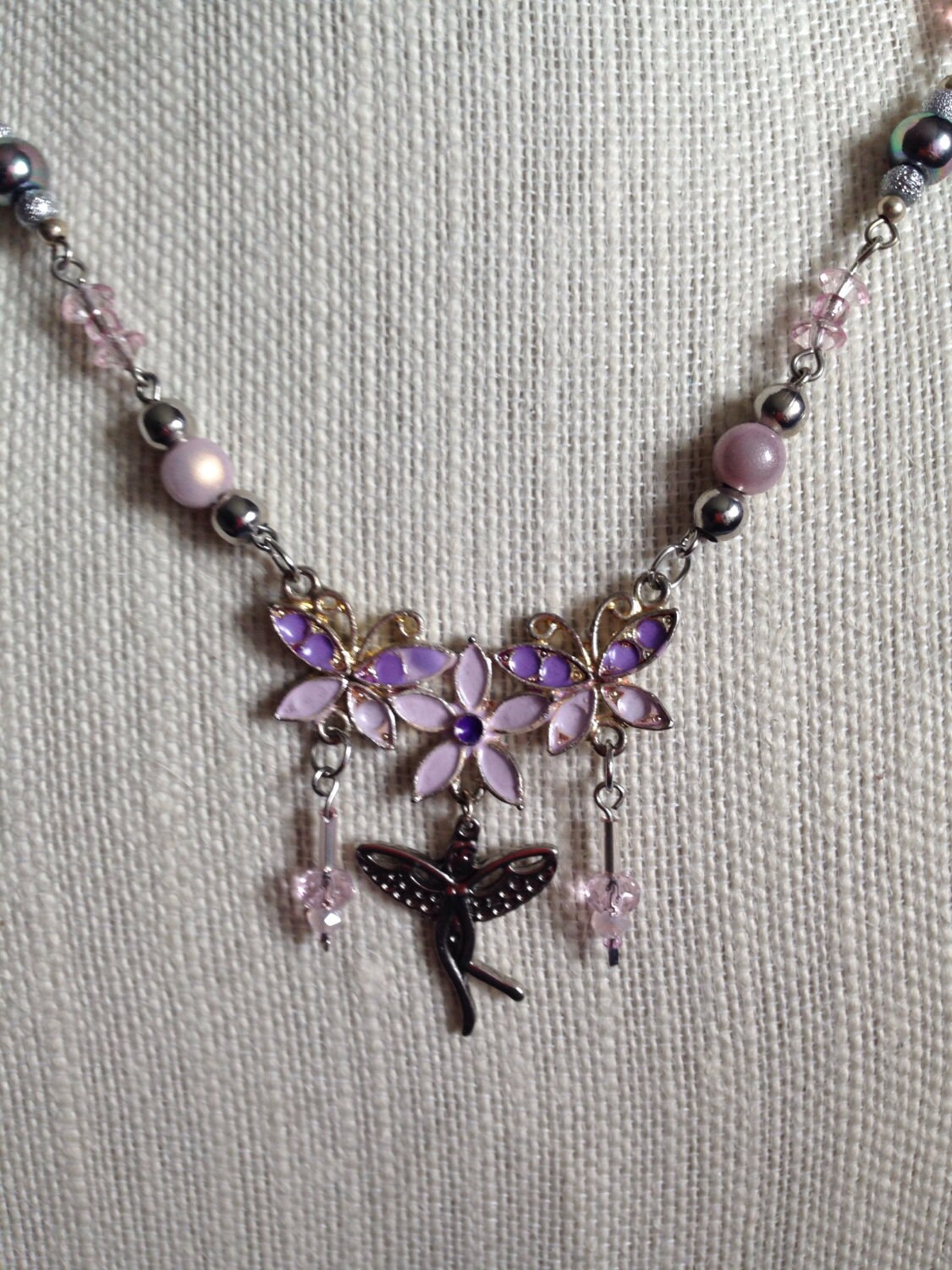 Pink beaded Fairy necklace with a pink and purple floral