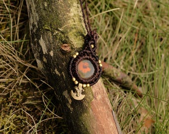 Brown ancestors earrings with orange flower