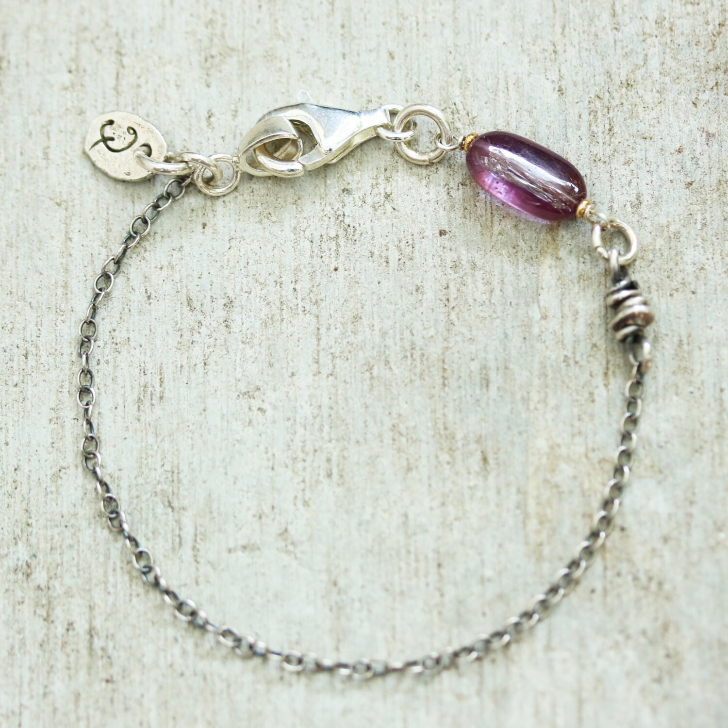 Ruby charm bracelet and silver beads with oxidized sterling