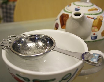 Metal vintage tea strainer with Blackpool crest, serving, tea ware