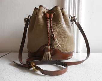 Authentic Dooney and Bourke Drawstring Handbag Taupe and Brown Leather/Suede Crossbody Handbag