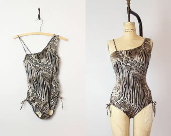 vintage 60s one piece swimsuit / 1960s leopard swimwear / asymmetrical shoulder swimsuit / side tie / mixed animal print maillot