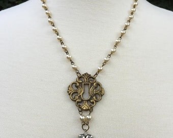 Vintage Assemblage Necklace with Antique-Brass Keyhole Escutcheon and Vintage Rhinestone Pendant